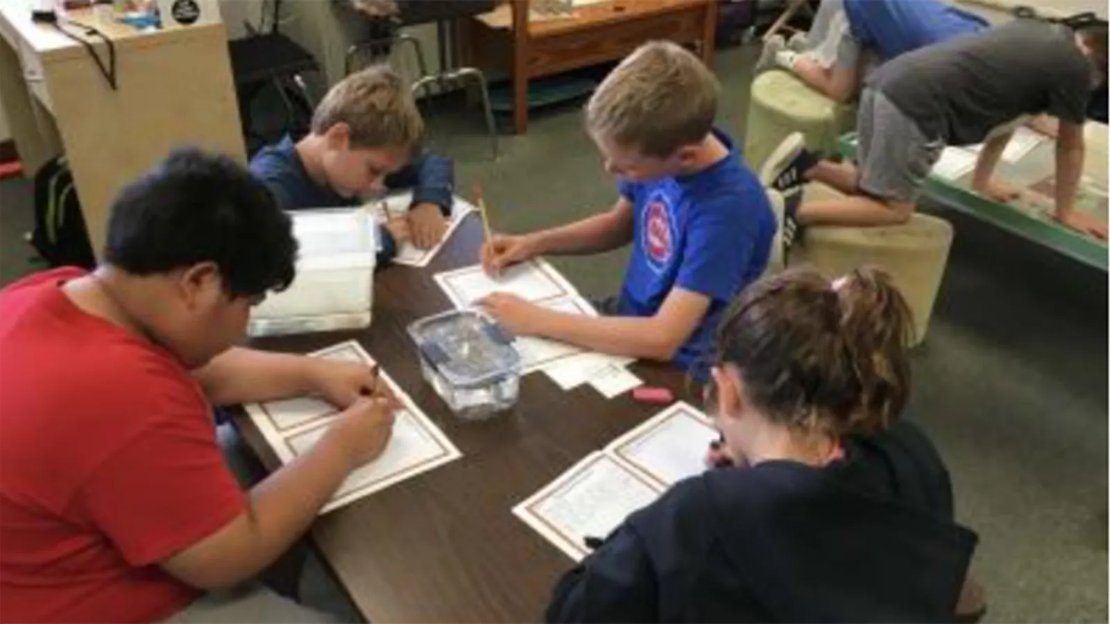 Four students working on zebrafish project