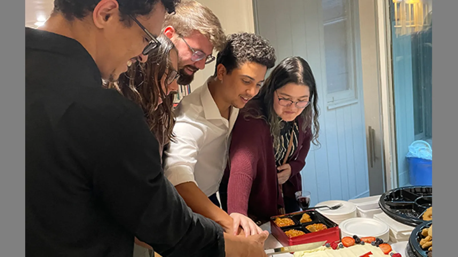 Molecular Genetics Fall Welcome Party cake cutting