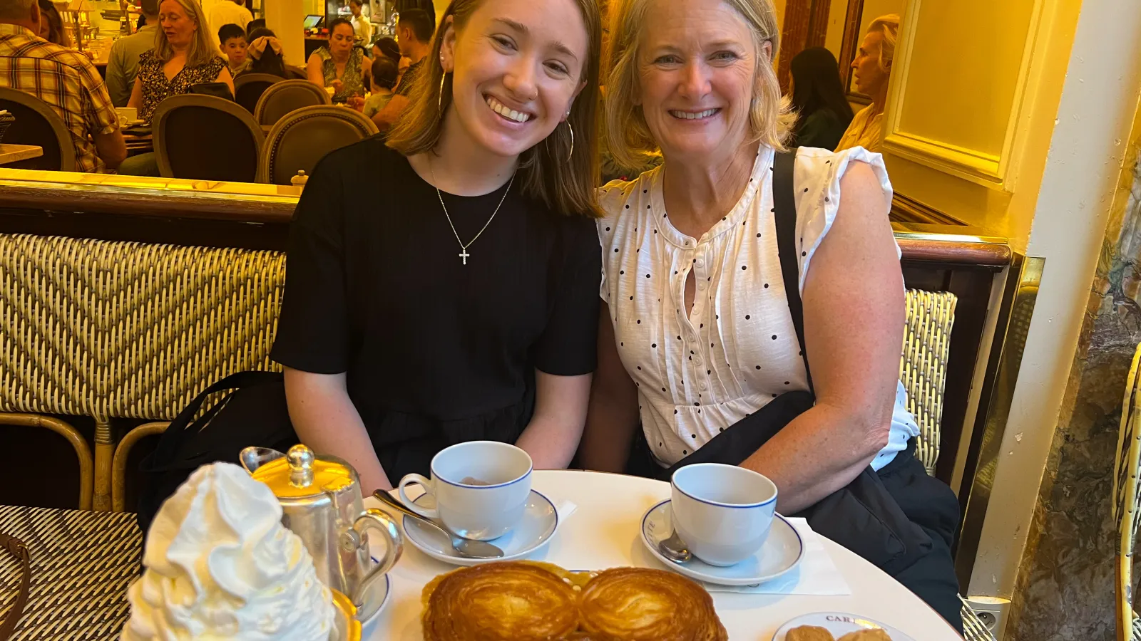 Emily Raiff with her host mother Elizabeth Husson enjoying Parisian pastries and coffee