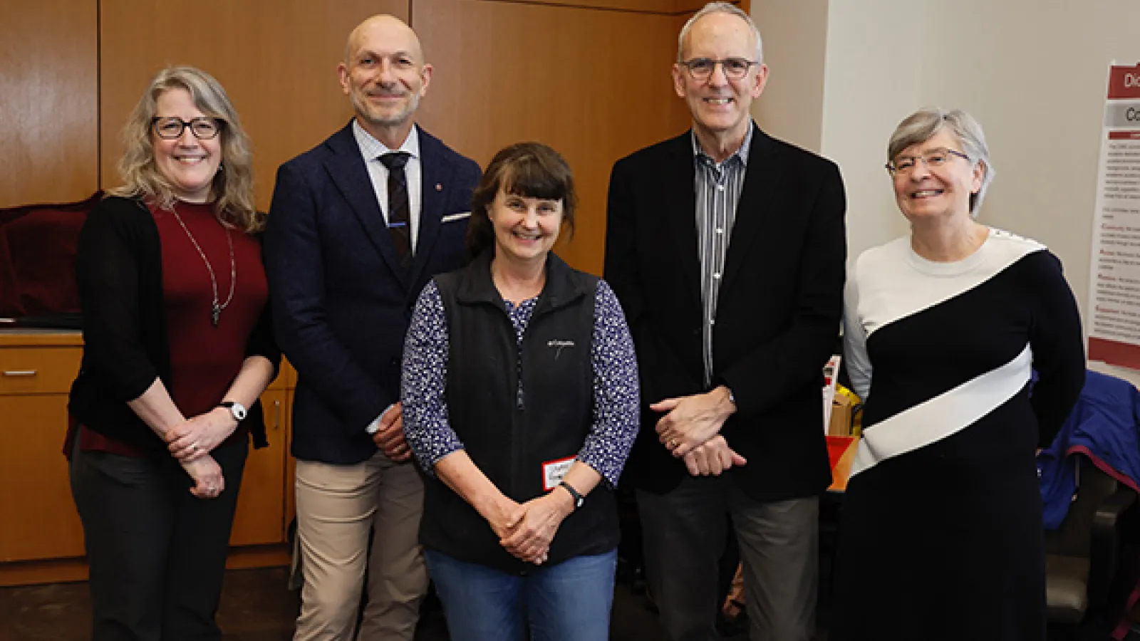 Sharon Amacher (center) with administrators at the surprise announcement