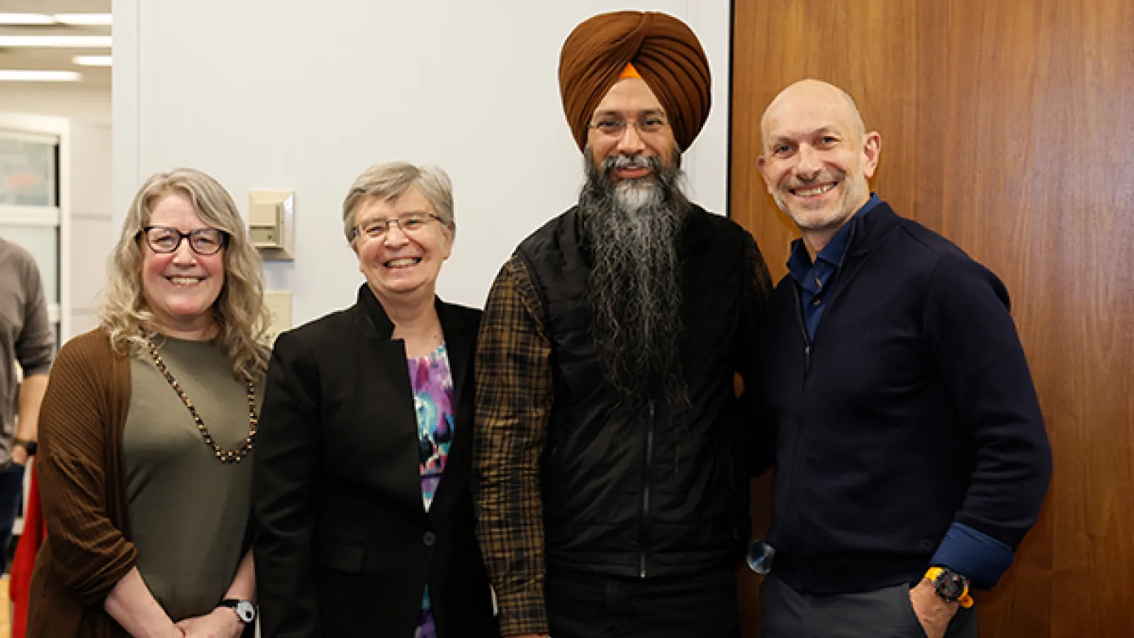 Amrit Singh together with award presenters