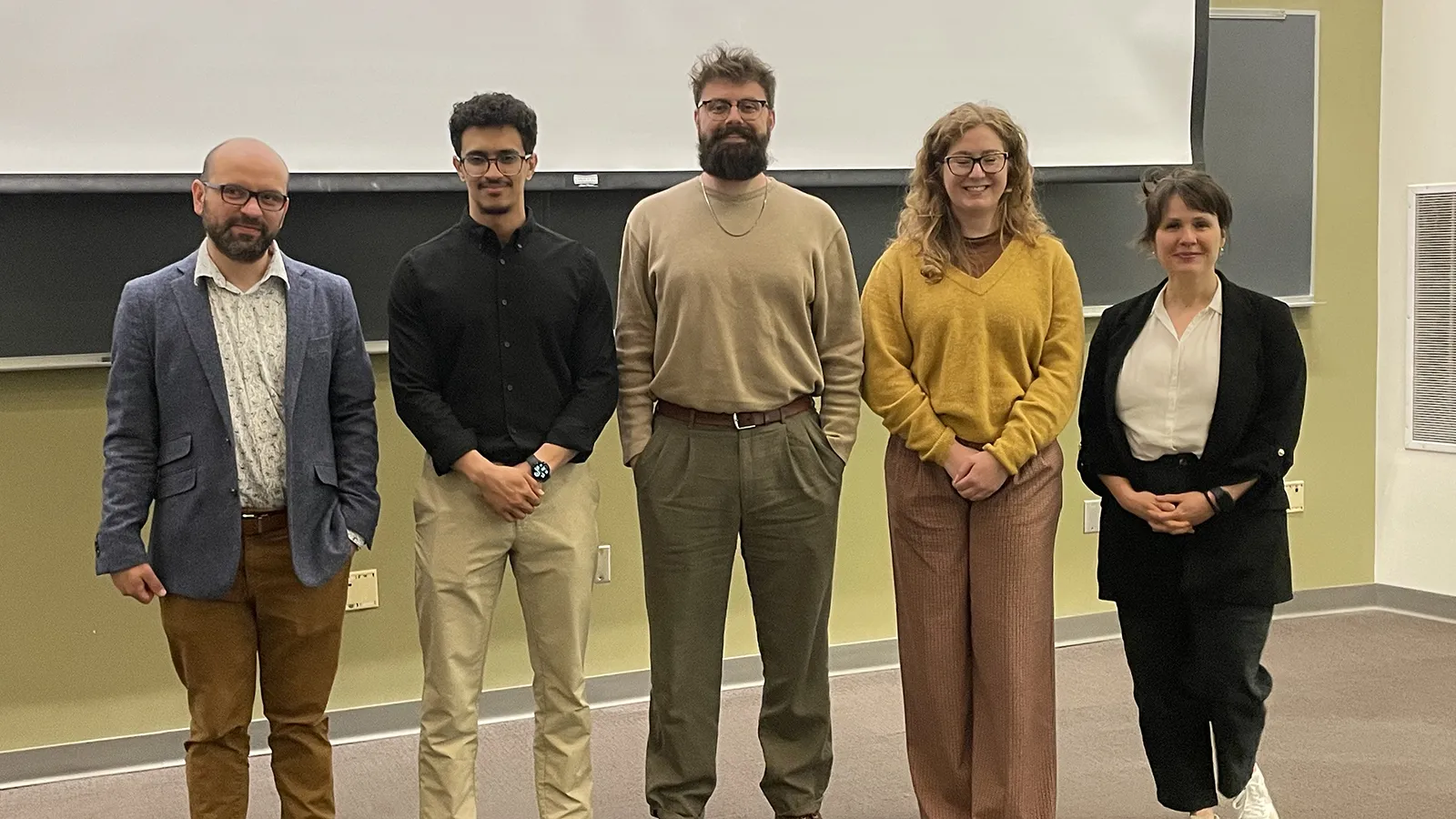 Keynote speaker Daniel Arango, student award winners Bader Albawali, Caleb Gooden, and Anna Lubertozzi, with colloquium organizer Rachel Belote