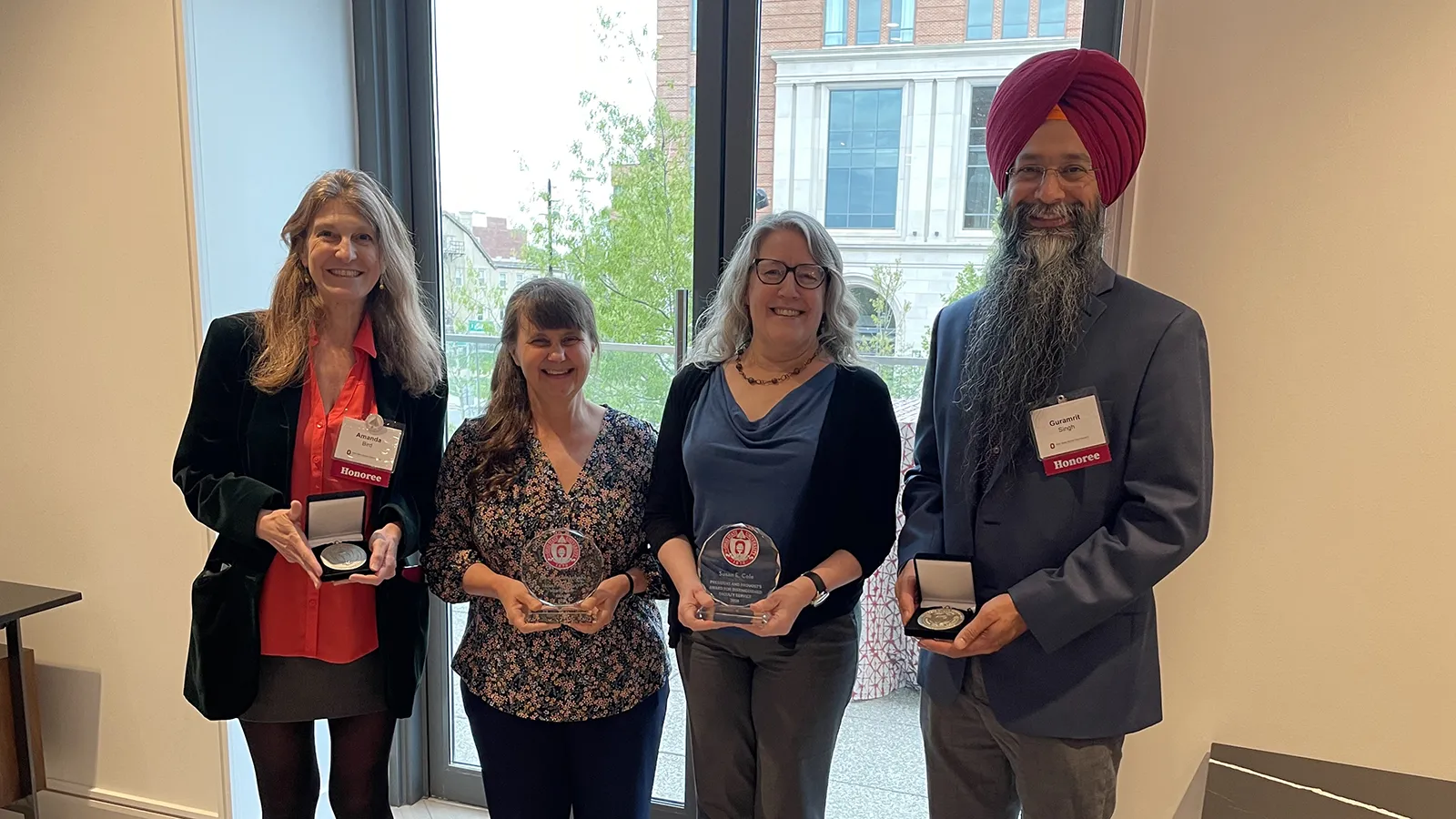 Amanda Bird, Sharon Amacher, Susan Cole, and Guramrit Singh holding their awards