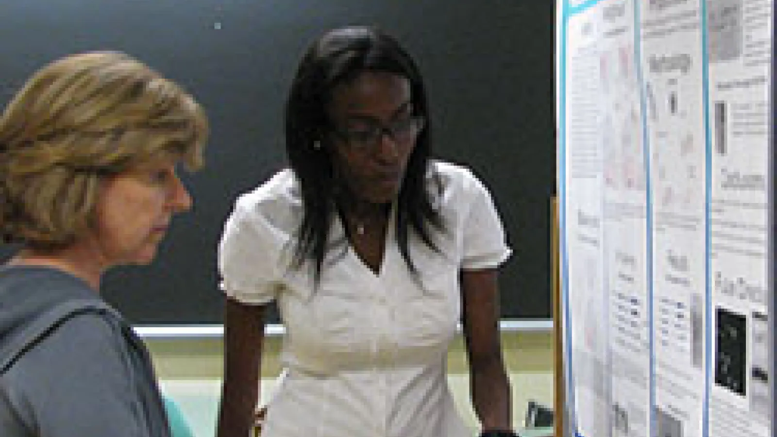 REU student presenting a scientific poster