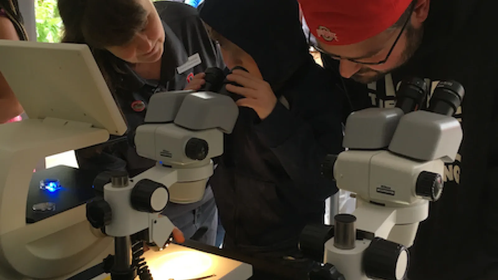 Kid using microscope
