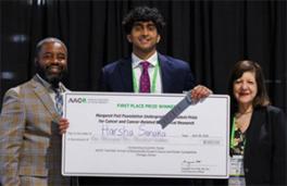 Harsha Sanaka and a giant check at AACR