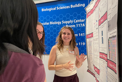 Sophie Cihan presenting a poster at the Molecualr Genetics open house