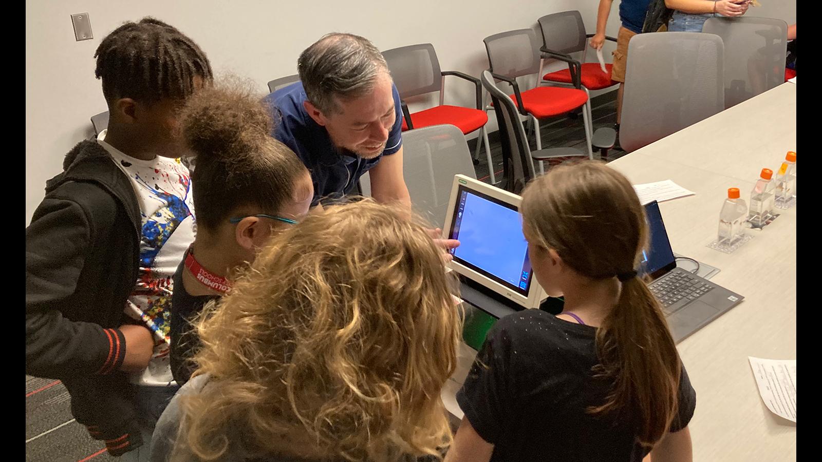 Students using a digital microscope