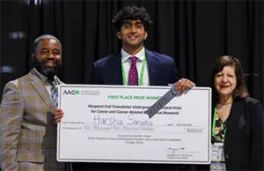 Harsha Sanaka and a giant check at AACR