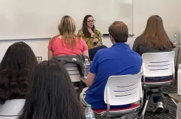 Maya talking to some Molecular Genetics students